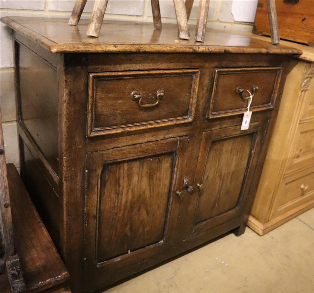 A mid 18th century oak side cabinet, width 96cm, depth 63cm, height 89cm